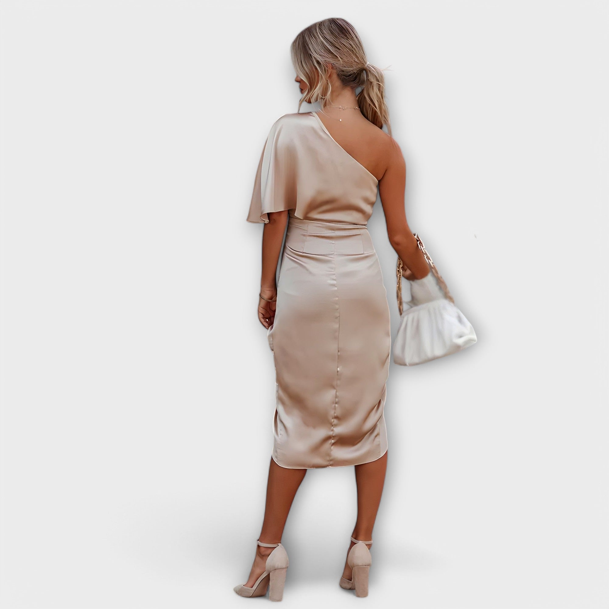 Champagne one-shoulder satin evening dress with draped waist and side slit, back view