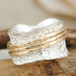 Two-tone rotating gold and silver textured ring band