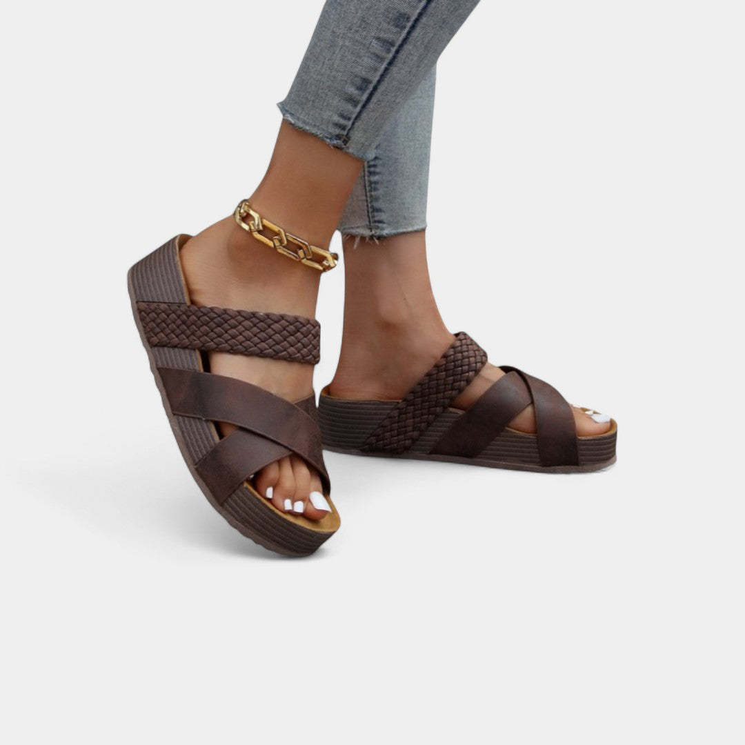 Brown comfort wedge sandals with ankle strap and braided crisscross straps