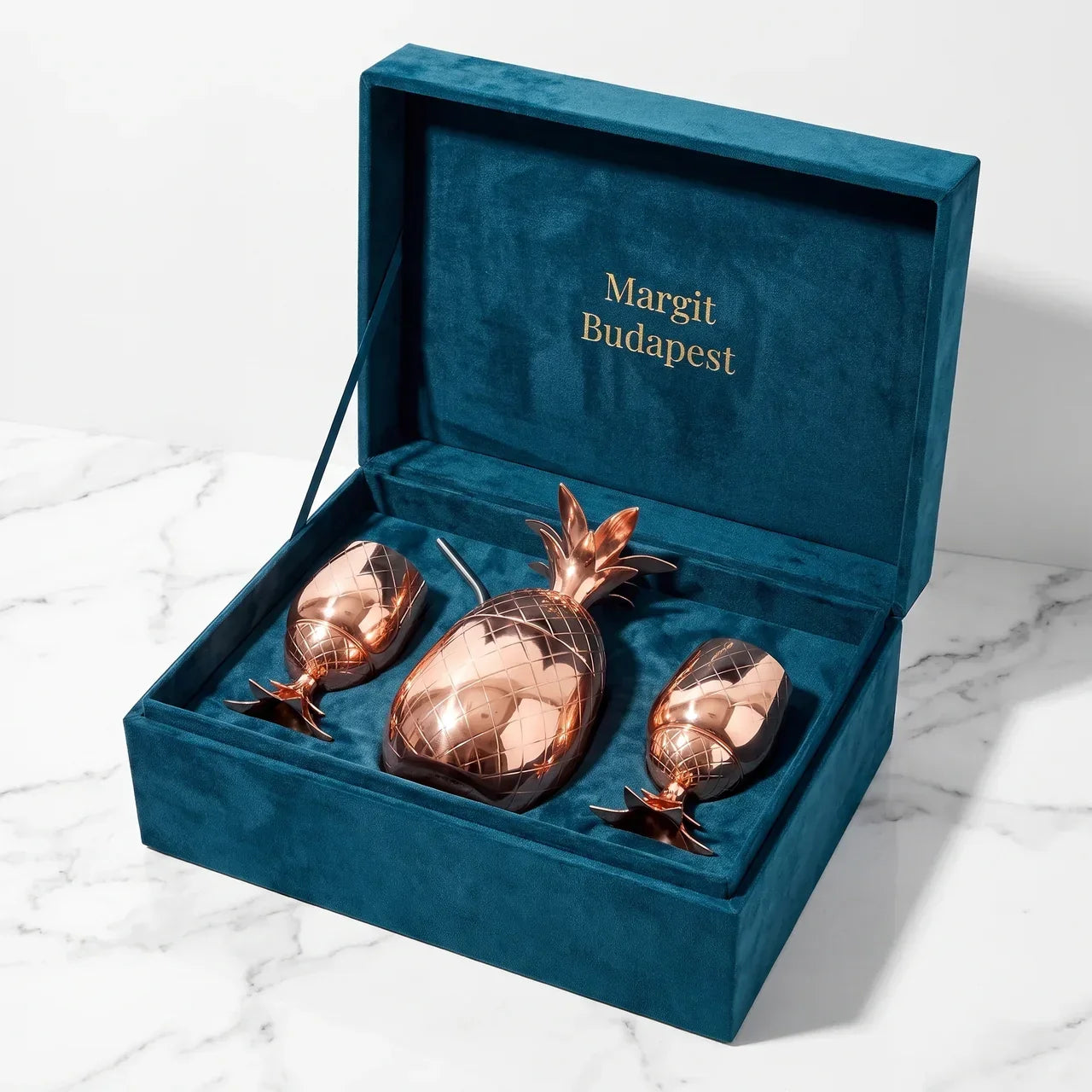 Copper pineapple-shaped pitcher set with two goblet cups in dark blue gift box