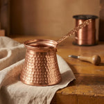 Hammered copper Turkish coffee pot with long handle, open top