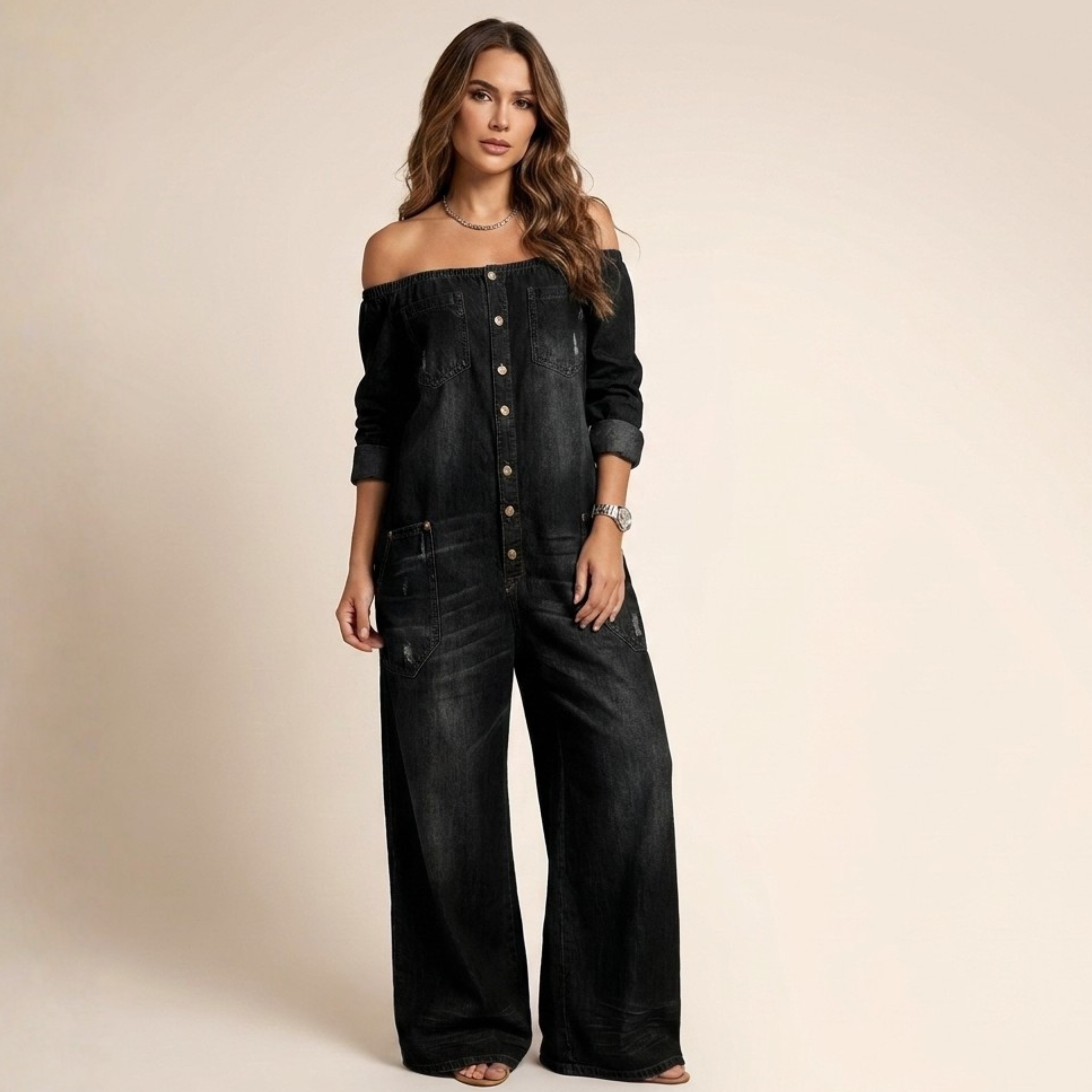 Off-shoulder denim jumpsuit in black with button front and wide-leg pant silhouette