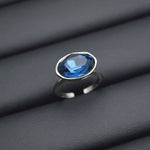 Oval blue gemstone vintage silver ring with polished metal band