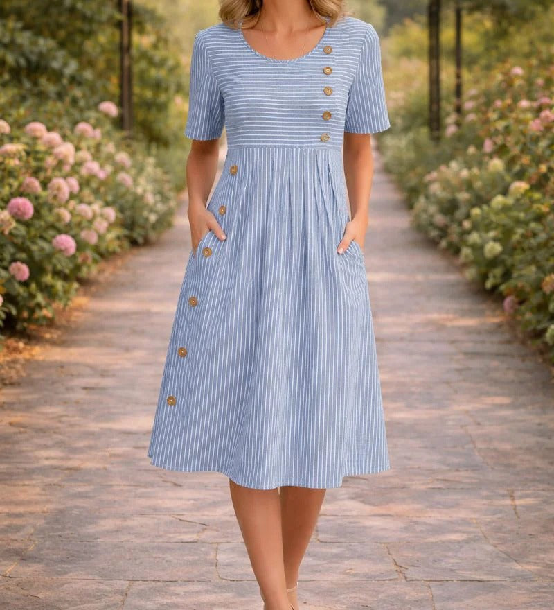 Light blue striped midi dress with short sleeves, button placket, and gathered waist