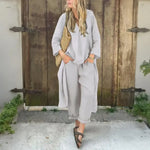 White two-piece shirt and cropped trousers set