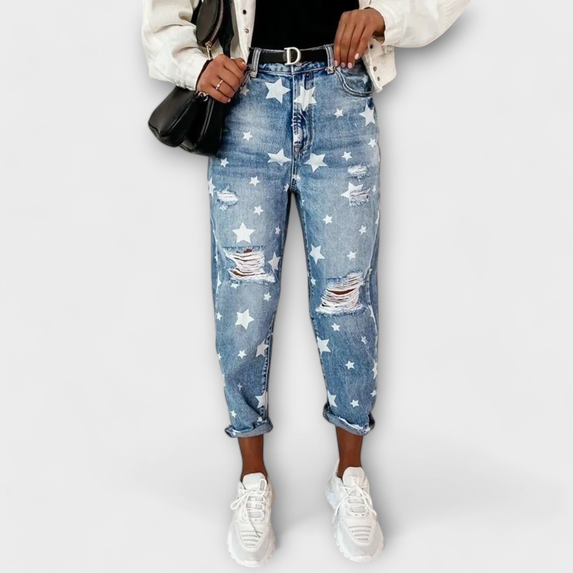 Ivy denim pants with white star print, distressed rips, cuffed hems, blue wash