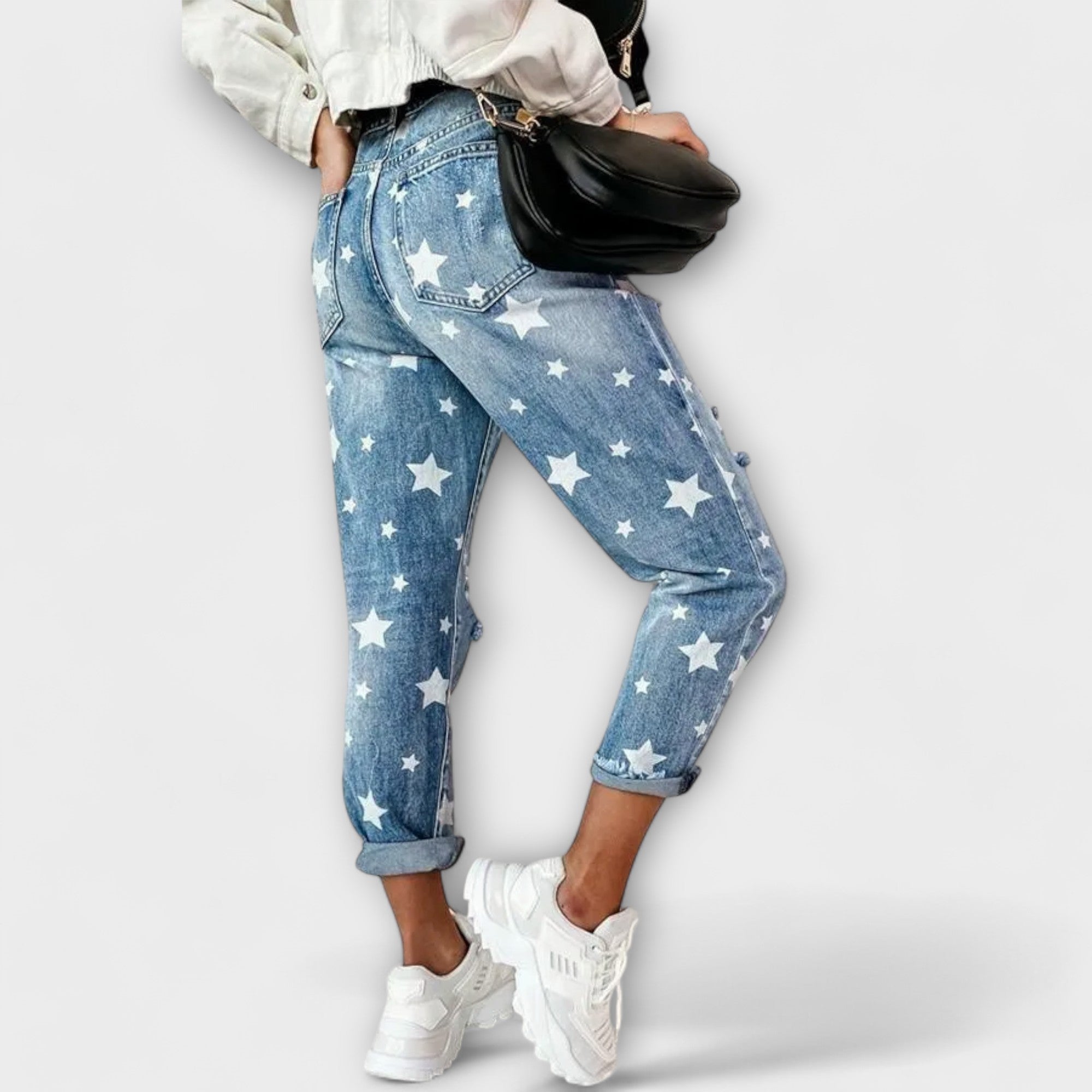 Ivy blue star-print denim pants with ripped detailing and cuffed ankle hems, casual fit