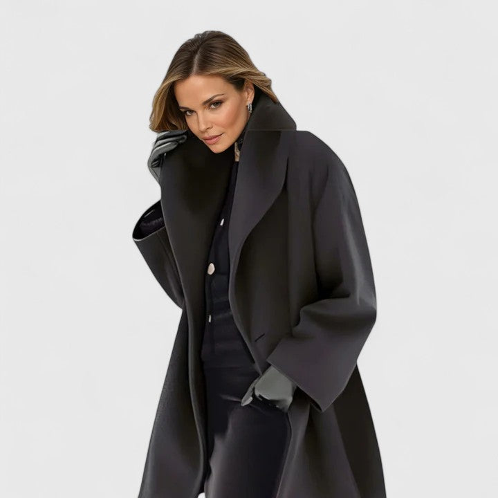 Black long tailored coat with notched lapels and single-button closure