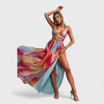 Sleeveless long printed maxi dress with multicolor abstract print; deep V neckline and long slit.