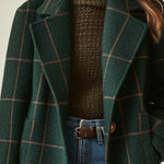 Dark green plaid tweed coat with notch lapels and brown button detail