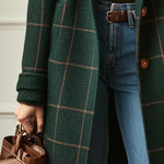 Dark green plaid tweed coat sleeve with rolled cuff and front pocket