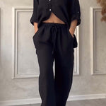 Black button-front shirt and elastic waist wide-leg pants set, full-body view