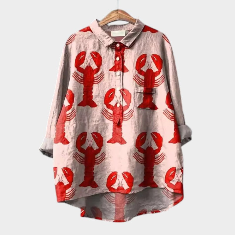 Light pink button-up blouse with red crab print, long sleeves and collar