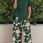 Isolde two-piece set: dark green blouse with short sleeves and green floral wide-leg pants