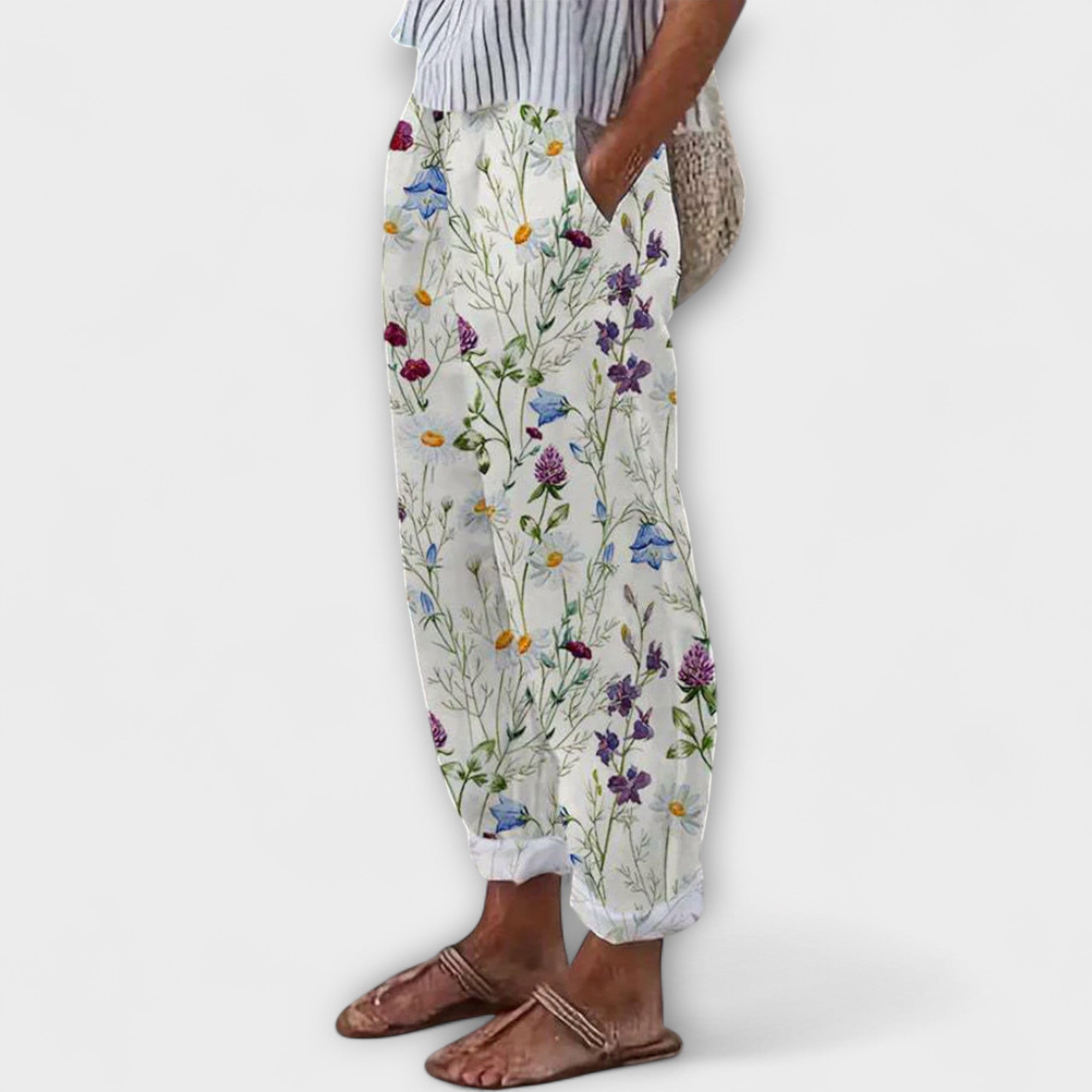 Wide-leg wildflower printed pants on off-white with colorful stems, elastic waist