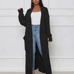 Black long knit cardigan with open front and textured vertical ribbed pattern