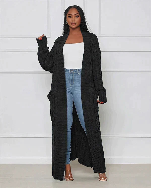 Black long knit cardigan with open front and textured vertical ribbed pattern