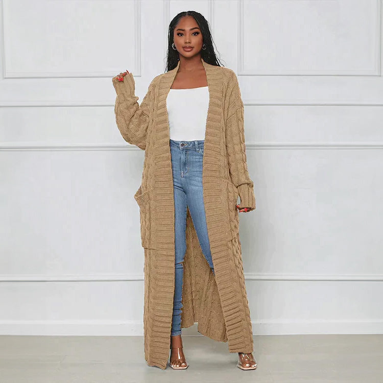 Beige long knit cardigan with open front and textured vertical ribbed pattern