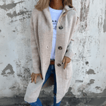 Beige long cardigan with button-front, patch pockets and long sleeves.