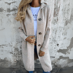 Beige long cardigan with button-front and side patch pockets, relaxed fit.