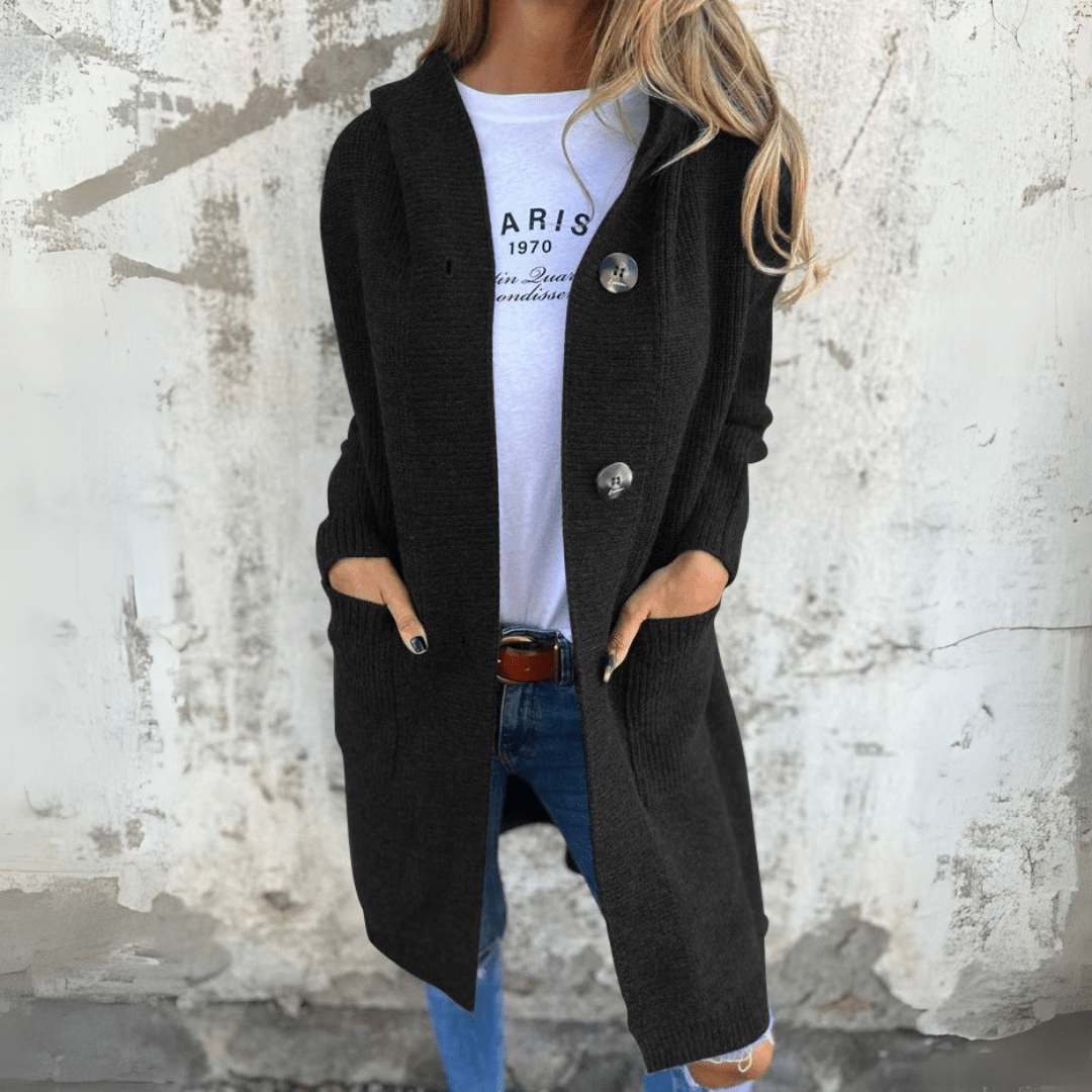 Black long cardigan with button-front, side patch pockets and relaxed silhouette.