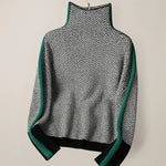 High-neck chevron sweater flat lay with green contrast trim and ribbed cuffs