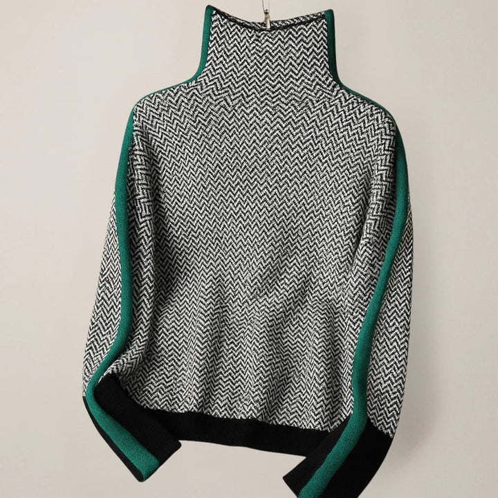 High-neck chevron sweater flat lay with green contrast trim and ribbed cuffs
