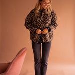 Leopard-print button-front jacket with long sleeves and chest pockets