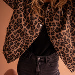 Leopard-print button-front jacket with long sleeves and two chest pockets