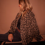 Leopard-print button-front jacket with long sleeves and curved hem