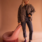 Leopard-print button-front jacket with long sleeves and chest pockets