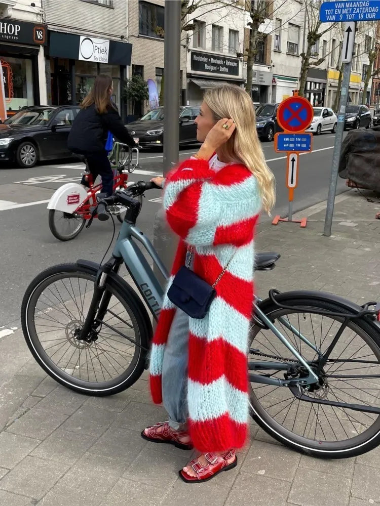 Oversized long striped cardigan with bold red and light blue fuzzy stripes, open front