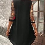 Black shift dress back view with sheer floral sleeves