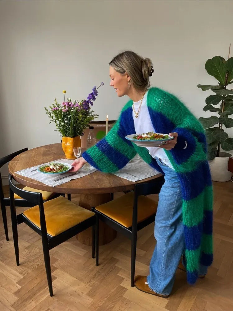 Oversized long striped cardigan with blue and green fuzzy stripes over a white top