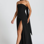 Women’s strapless black maxi dress with thigh-high side slit and long trailing panel.