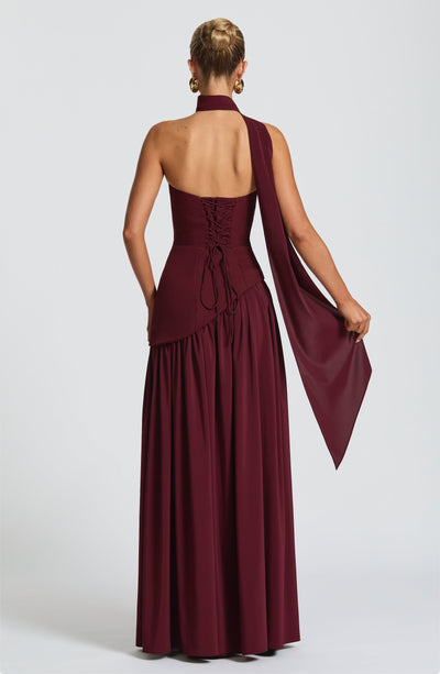 Women’s burgundy strapless maxi dress with corset bodice and tiered skirt