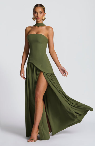 Women’s strapless olive green maxi dress with high side slit and draped overskirt.