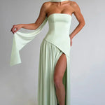 Women’s strapless maxi dress in pale mint green, with high side slit and draped cape.