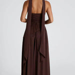 Back view of burgundy strapless maxi dress with draped tiers and open-back straps