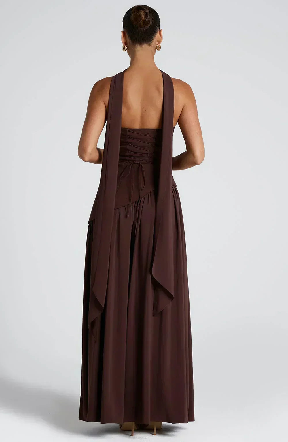 Back view of burgundy strapless maxi dress with draped tiers and open-back straps