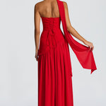 Women’s backless red maxi dress with ruched bodice, open back, and trailing sash