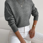 Dark gray knit crewneck pullover with long sleeves and ribbed cuffs