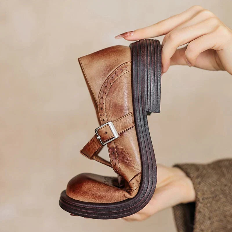 Brown leather Mary Jane shoe with adjustable buckle strap and textured sole