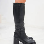 Black knee-high heeled boots with smooth upper and chunky block heel