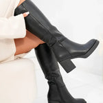 Black tall heeled boots with squared toe and chunky mid-heel, smooth leather