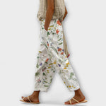 Wide-leg botanical floral printed pants on off-white, gathered elastic waist