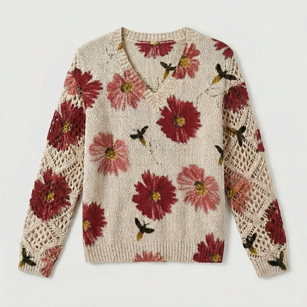 Cream knit floral pullover sweater with red flowers and crochet-knit sleeve panels