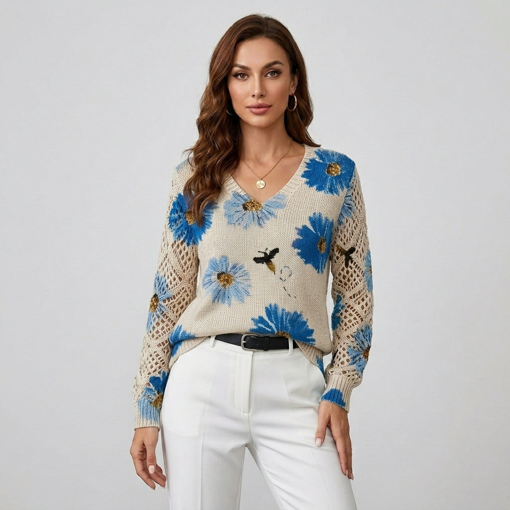 Cream knit floral pullover with blue flowers, V-neck and button; crochet-knit sleeves