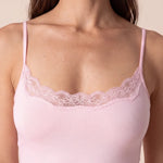 Pale pink slip dress bodice with lace neckline and thin spaghetti straps