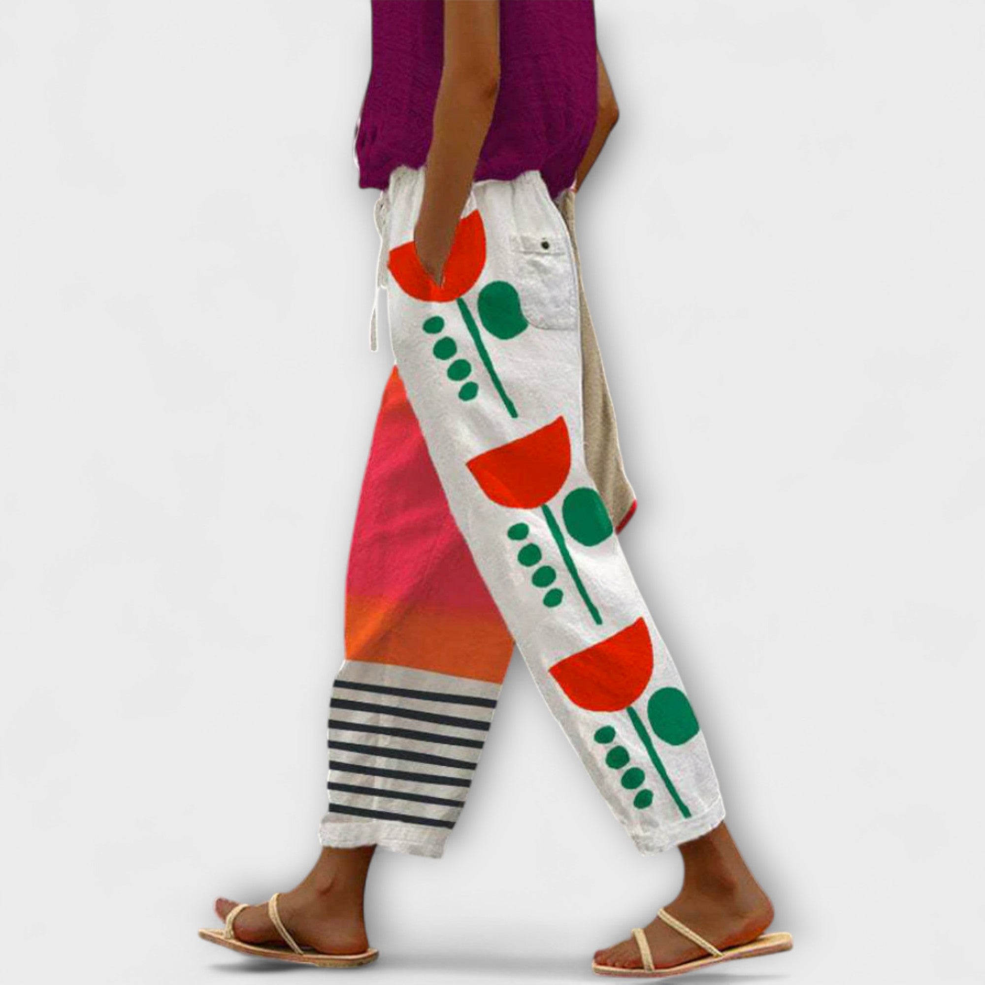 Wide-leg abstract plant printed pants on off-white with red and green blocks